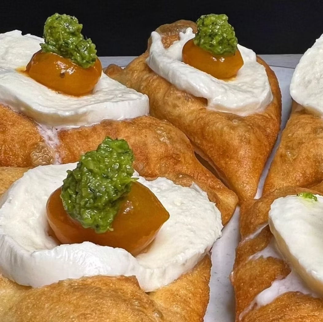Montanare with buffalo mozzarella and pesto on dark background